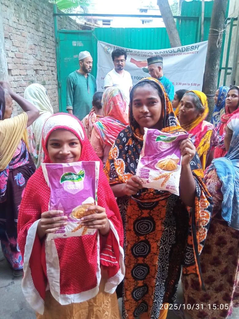 Two women happily receiving food packages