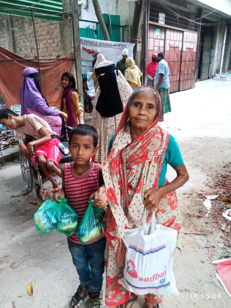 Grandmother and child receiving food assistance